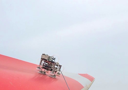 Blade Robot crawler traversing a wind turbine blade during a field test